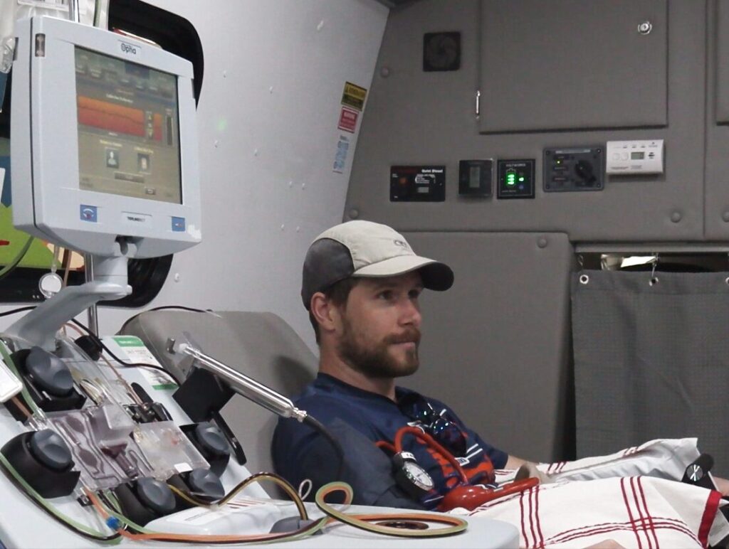Simon Hart donates cells in the BBG Advanced Therapies mobile leukapheresis center, the first vehicle of its kind.